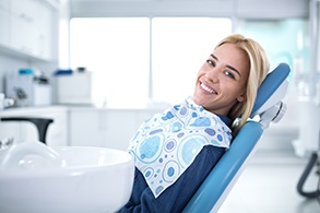 Smiling woman sitting in dental office