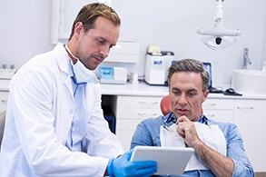 A man consulting his dentist about oral conscious sedation